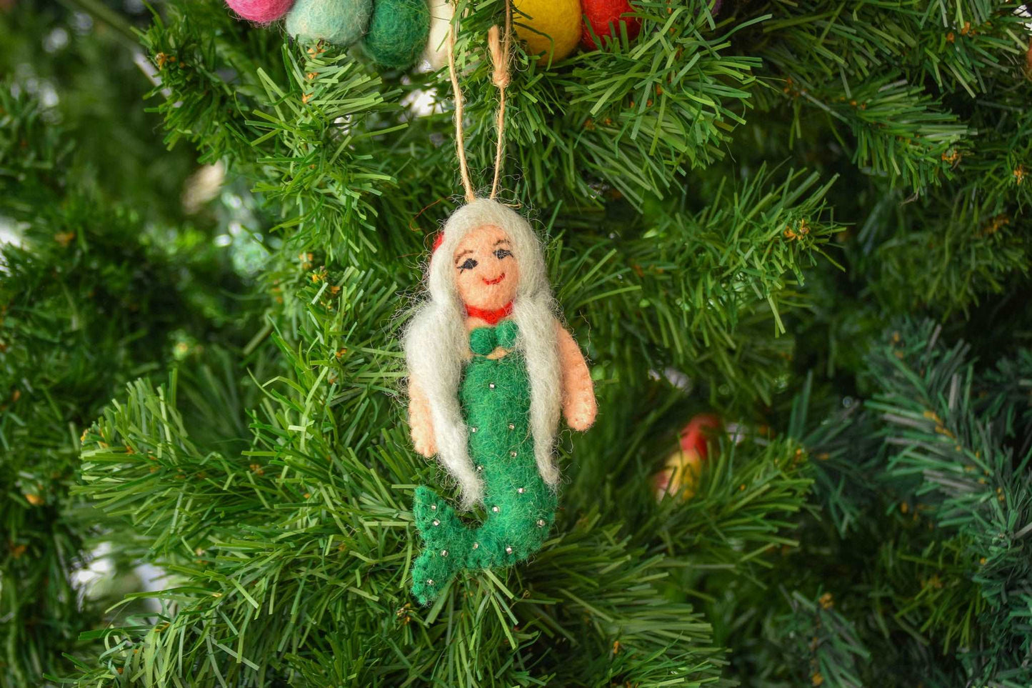 This Global Groove Life, handmade, ethical, fair trade, eco-friendly, sustainable, green, white and red, felt Mermaid with Starfish ornament set was created by artisans in Kathmandu Nepal and will be a beautiful addition to your Christmas tree this holiday season.