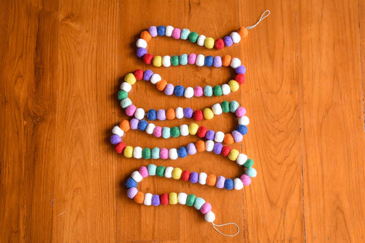 This Global Groove Life, handmade, ethical, fair trade, eco-friendly, sustainable, felt, red, white, pink, green, blue, purple, and orange felt Gumdrop garland ,was created by artisans in Kathmandu Nepal and will bring beautiful color, warmth and fun to your home.