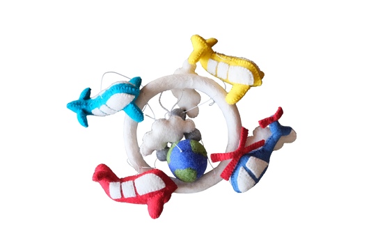 This Global Groove Life, handmade, ethical, fair trade, eco-friendly, sustainable, white, green, yellow, red, blue, New Zealand wool felt Global Groove Flight mobile, with planes and clouds and helicopter, was created by artisans in Kathmandu Nepal and will be a beautiful and fun addition to your home.