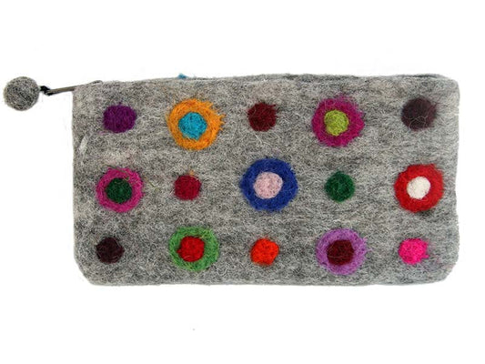 This Global Groove Life, handmade, ethical, fair trade, eco-friendly, sustainable, blue, orange, pink, red, green, purple, white, and grey colored, New Zealand wool zipper coin purse was created by artisans in Kathmandu Nepal and is adorned with a polka dot motif and a pom pom zipper pull.