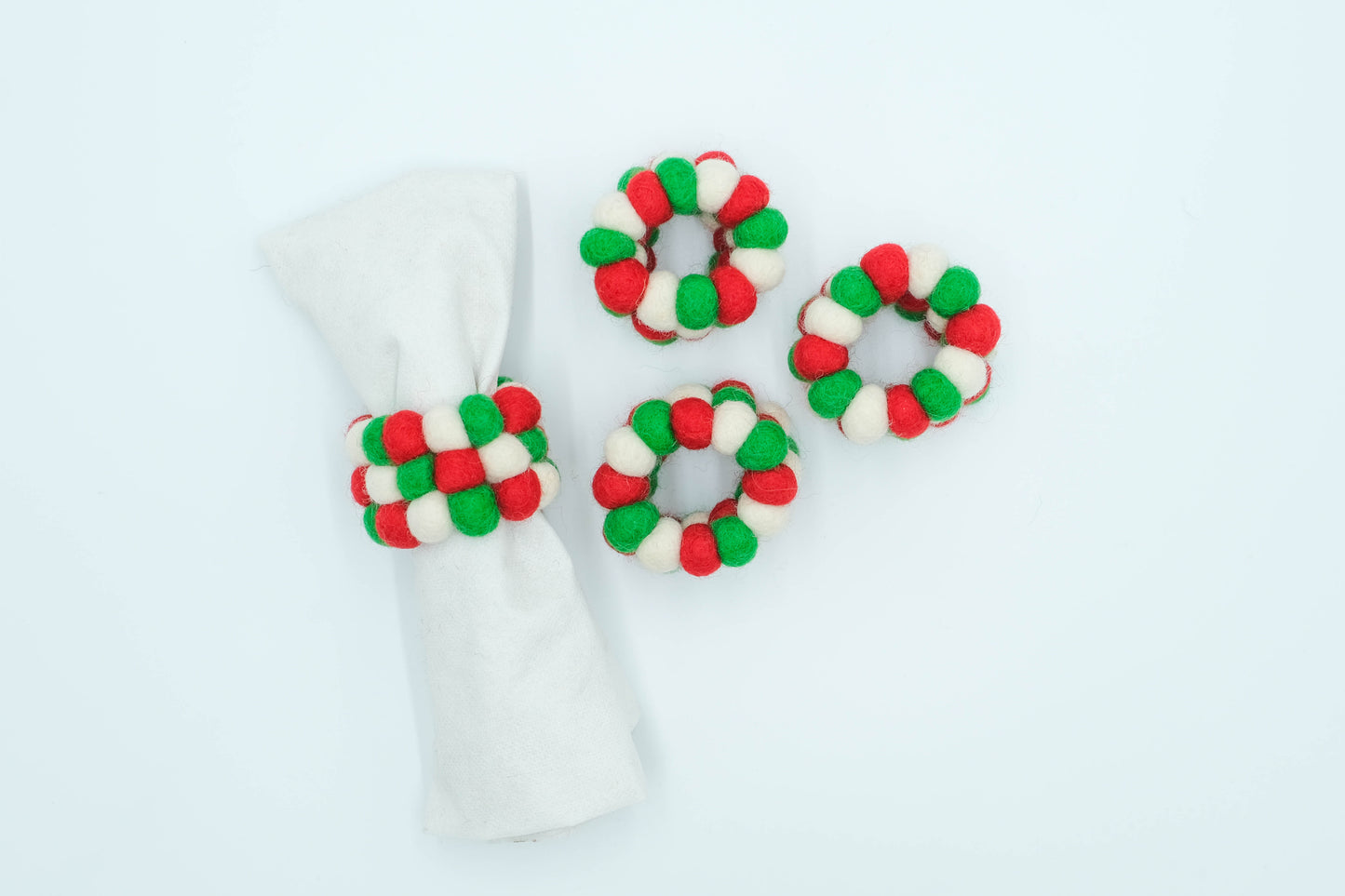 This Global Groove Life, handmade, ethical, fair trade, eco-friendly, sustainable, felt red, white and green Napkin Ring set was created by artisans in Kathmandu Nepal and will bring colorful warmth and functionality to your table top.