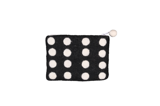 This Global Groove Life, handmade, ethical, fair trade, eco-friendly, sustainable, black & white domino colored, New Zealand wool zipper coin purse was created by artisans in Kathmandu Nepal and is adorned with a polka dot motif and a pom pom zipper pull.