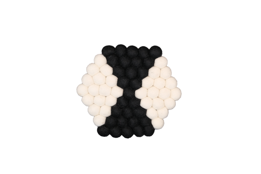 This Global Groove Life, handmade, ethical, fair trade, eco-friendly, sustainable, black & white 100% New Zealand wool felt trivet was created by artisans in Kathmandu Nepal and will bring colorful warmth and functionality to your table top.