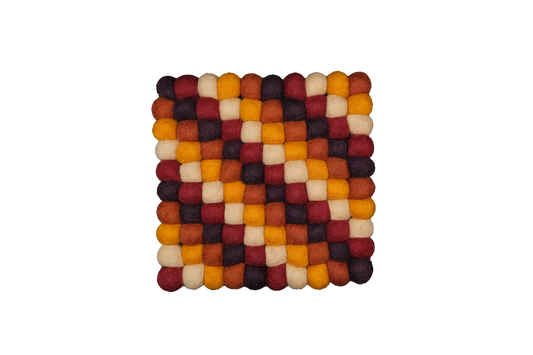 This Global Groove Life, handmade, ethical, fair trade, eco-friendly, sustainable, harvest colored 100% New Zealand hexagonal wool felt trivet was created by artisans in Kathmandu Nepal and will bring colorful warmth and functionality to your table top.