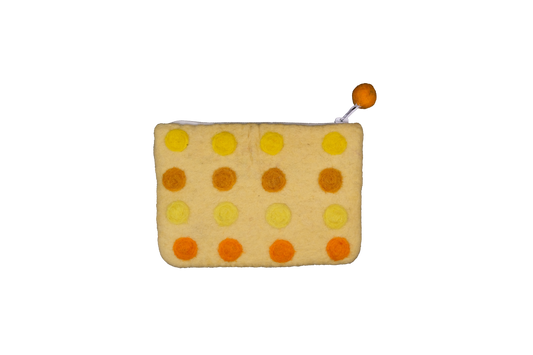 This Global Groove Life, handmade, ethical, fair trade, eco-friendly, sustainable, yellow and orange colored, New Zealand wool zipper coin purse was created by artisans in Kathmandu Nepal and is adorned with a polka dot motif and a pom pom zipper pull.