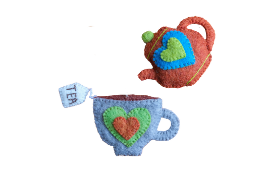 This Global Groove Life, handmade, ethical, fair trade, eco-friendly, sustainable, New Zealand wool felt, grey, blue, cinnamon & green heart teapot and teacup ornament set was created by artisans in Kathmandu Nepal and will bring colorful warmth and fun to your Christmas tree this season.