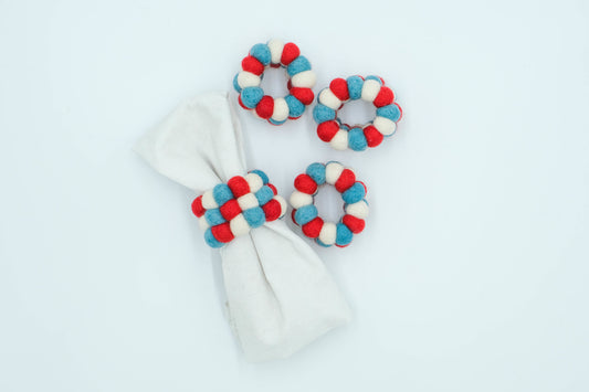 This Global Groove Life, handmade, ethical, fair trade, eco-friendly, sustainable, felt blue, white and red Kai Xmas Napkin Ring set was created by artisans in Kathmandu Nepal and will bring colorful warmth and functionality to your table top.