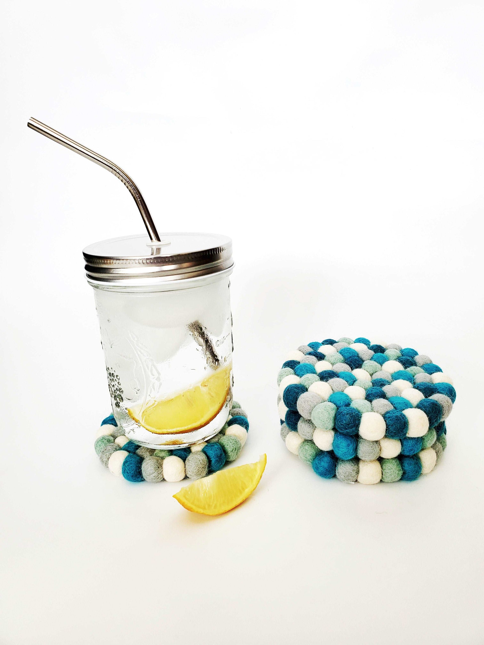 This Global Groove Life, handmade, ethical, fair trade, eco-friendly, sustainable, felt Glacier Blue coaster set was created by artisans in Kathmandu Nepal and will bring colorful warmth and functionality to your table top.