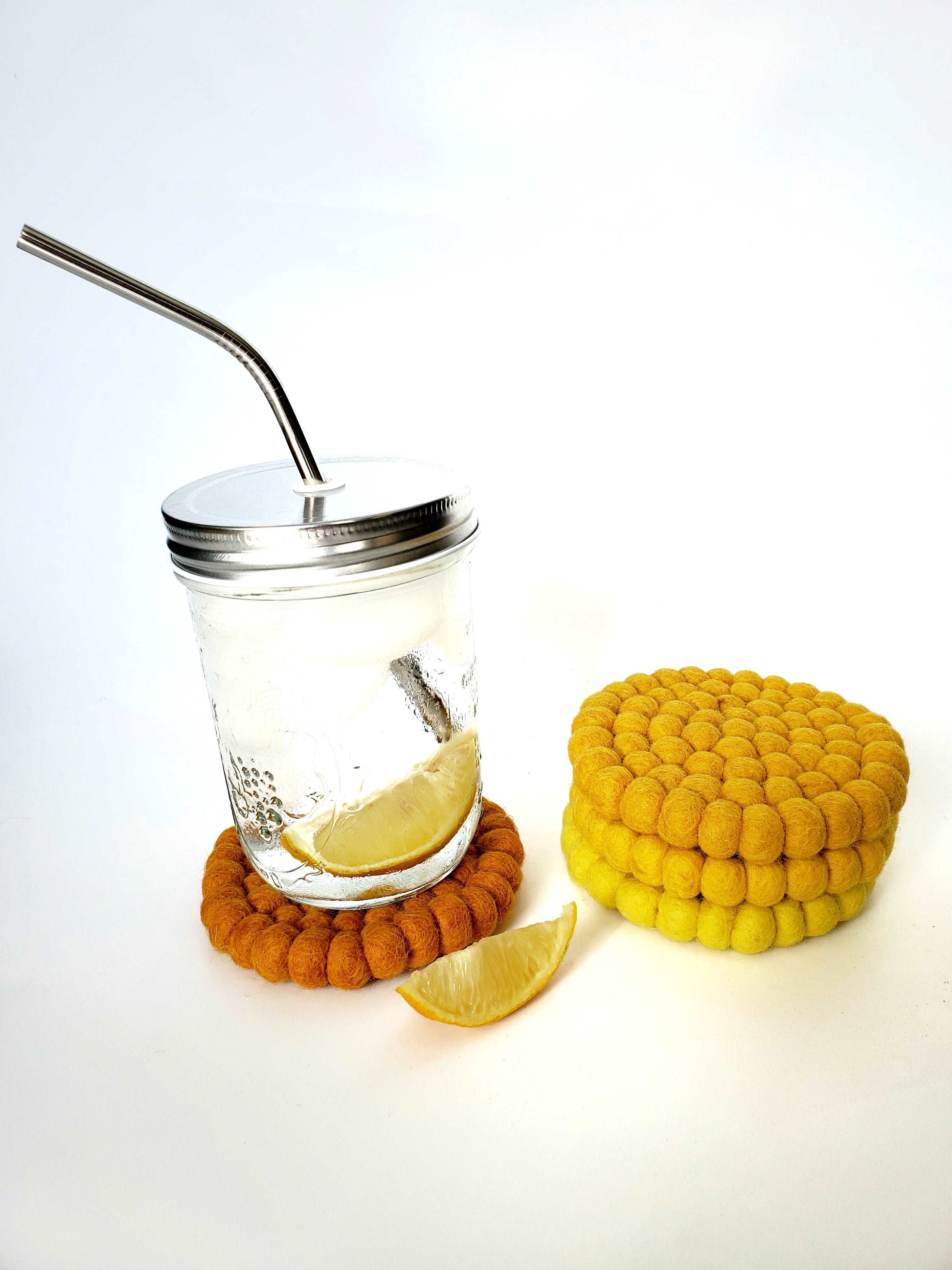 This Global Groove Life, handmade, ethical, fair trade, eco-friendly, sustainable, felt Mustard Tonal coaster set was created by artisans in Kathmandu Nepal and will bring colorful warmth and functionality to your table top.