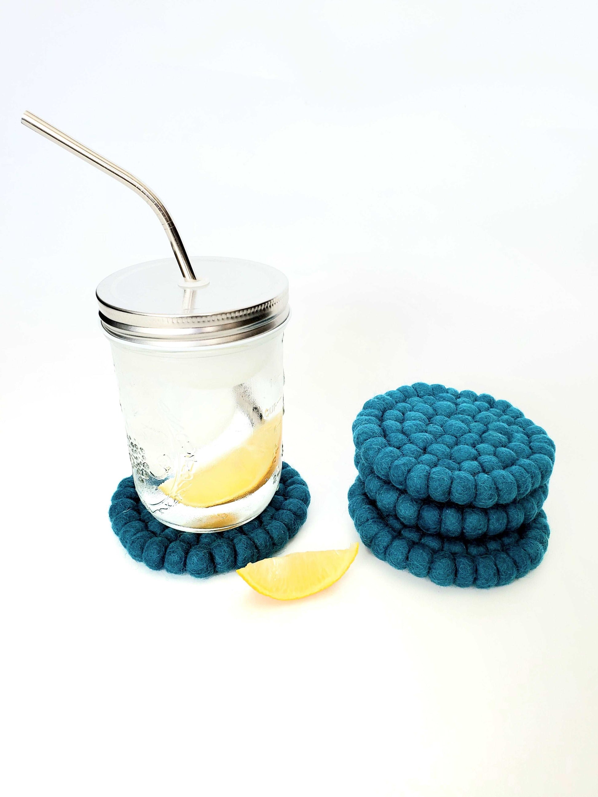 This Global Groove Life, handmade, ethical, fair trade, eco-friendly, sustainable, felt Teal coaster set was created by artisans in Kathmandu Nepal and will bring colorful warmth and functionality to your table top.