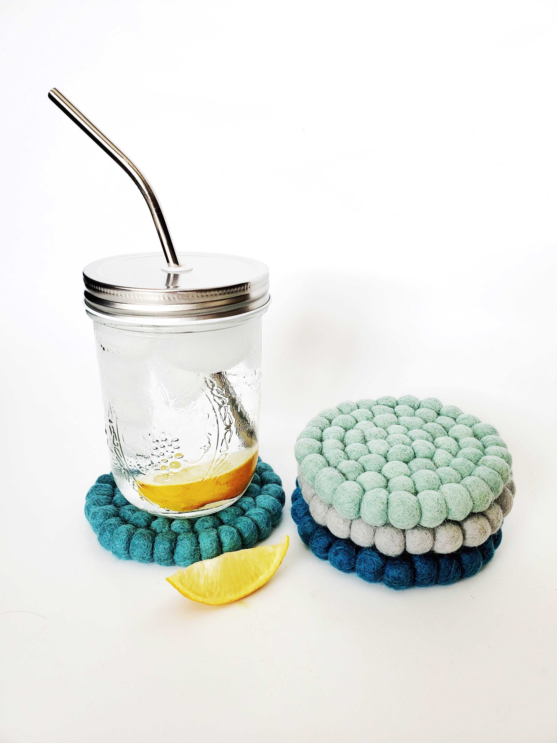 This Global Groove Life, handmade, ethical, fair trade, eco-friendly, sustainable, felt Teal Tonal coaster set was created by artisans in Kathmandu Nepal and will bring colorful warmth and functionality to your table top.