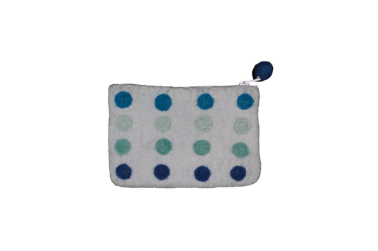 This Global Groove Life, handmade, ethical, fair trade, eco-friendly, sustainable, blue colored, New Zealand wool zipper coin purse was created by artisans in Kathmandu Nepal and is adorned with a polka dot motif and a pom pom zipper pull.