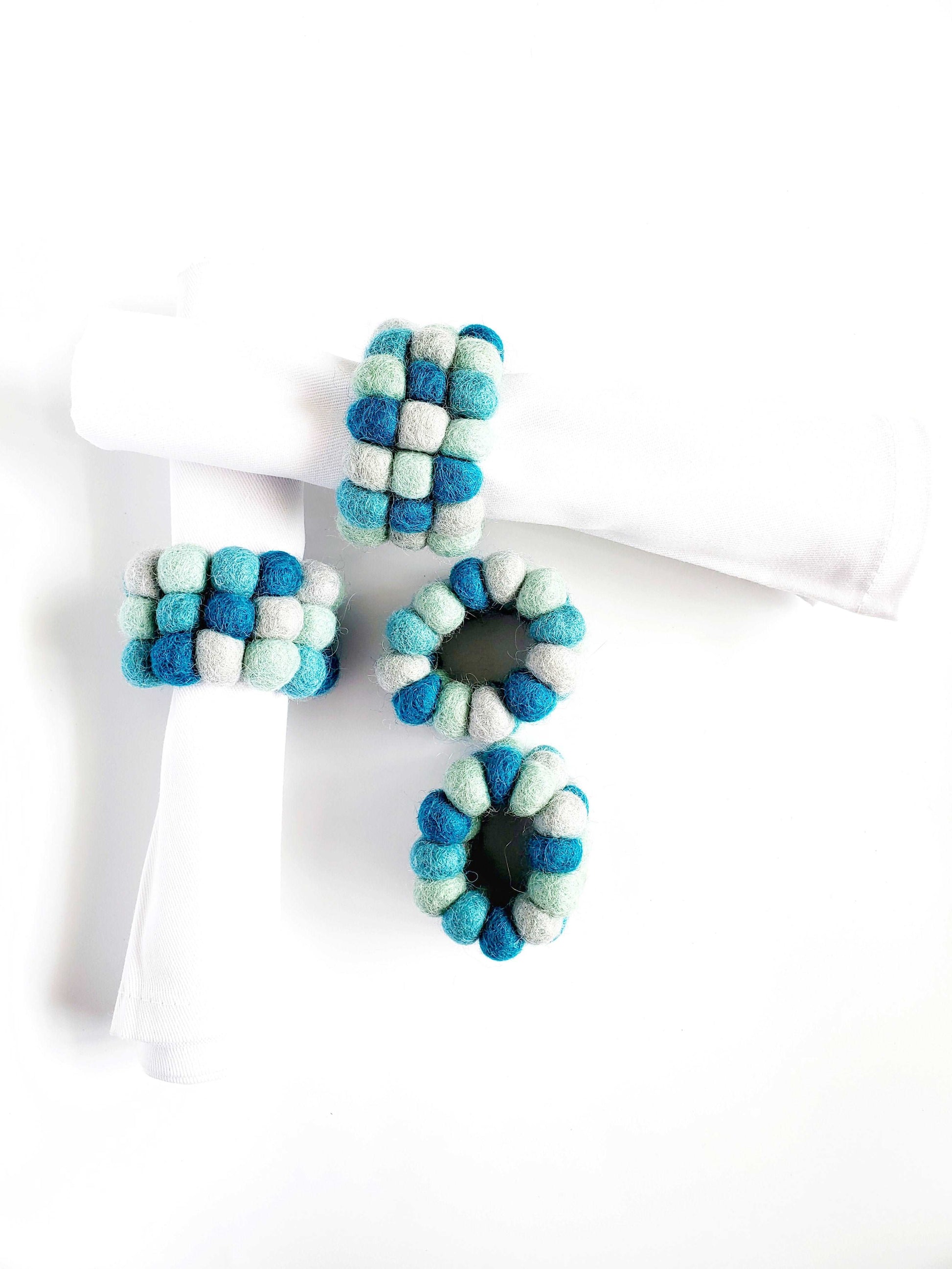 This Global Groove Life, handmade, ethical, fair trade, eco-friendly, sustainable, felt Ocean Sky Blue Napkin Ring set was created by artisans in Kathmandu Nepal and will bring colorful warmth and functionality to your table top.