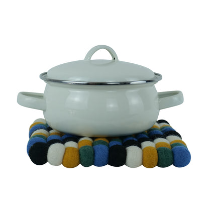 This Global Groove Life, handmade, ethical, fair trade, eco-friendly, sustainable, black, yellow, green & white 100% New Zealand wool felt Moroccan inspired trivet was created by artisans in Kathmandu Nepal and will bring colorful warmth and functionality to your table top.