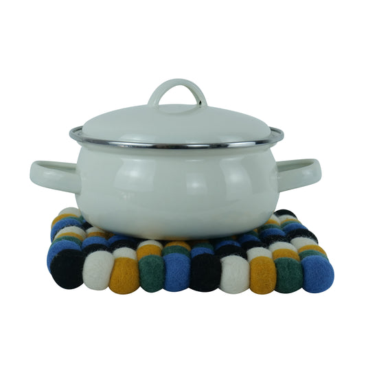 This Global Groove Life, handmade, ethical, fair trade, eco-friendly, sustainable, black, yellow, green & white 100% New Zealand wool felt Moroccan inspired trivet was created by artisans in Kathmandu Nepal and will bring colorful warmth and functionality to your table top.