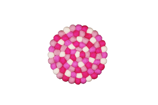 This Global Groove Life, handmade, ethical, fair trade, eco-friendly, sustainable pink & white 100% New Zealand wool felt trivet was created by artisans in Kathmandu Nepal and will bring colorful warmth and functionality to your table top.