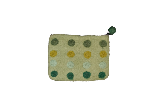 This Global Groove Life, handmade, ethical, fair trade, eco-friendly, sustainable, green colored, New Zealand wool zipper coin purse was created by artisans in Kathmandu Nepal and is adorned with a polka dot motif and a pom pom zipper pull.