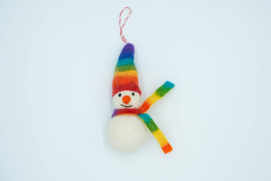 This Global Groove Life, handmade, ethical, fair trade, eco-friendly, sustainable, rainbow felt Frosty the Snow Cone friend, snow man ornament was created by artisans in Kathmandu Nepal and will bring colorful warmth and fun to your Christmas tree.