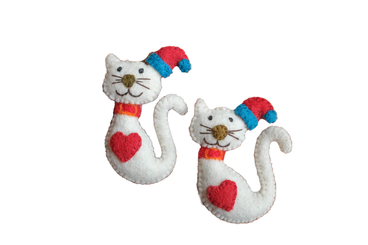 This Global Groove Life, handmade, ethical, fair trade, eco-friendly, sustainable, red, white and turquoise felt Kitty Cat with Santa hat and heart ornament set was created by artisans in Kathmandu Nepal and will be a beautiful and fun addition to your Christmas tree this holiday season.