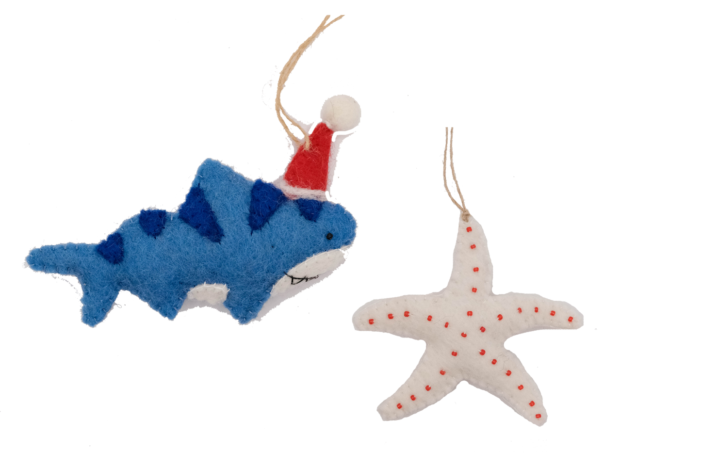 This Global Groove Life, handmade, ethical, fair trade, eco-friendly, sustainable, blue, white and red, felt Shark Santa with Starfish ornament set was created by artisans in Kathmandu Nepal and will be a beautiful addition to your Christmas tree this holiday season.