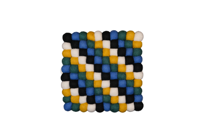 This Global Groove Life, handmade, ethical, fair trade, eco-friendly, sustainable, black, yellow, green & white 100% New Zealand wool felt Moroccan inspired trivet was created by artisans in Kathmandu Nepal and will bring colorful warmth and functionality to your table top.