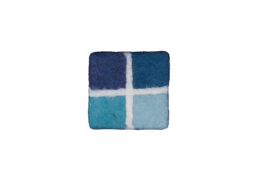 This Global Groove Life, handmade, ethical, fair trade, eco-friendly, sustainable, New Zealand wool felt, Ocean blue coaster set, was created by artisans in Kathmandu Nepal and will bring colorful warmth and functionality to your table top.