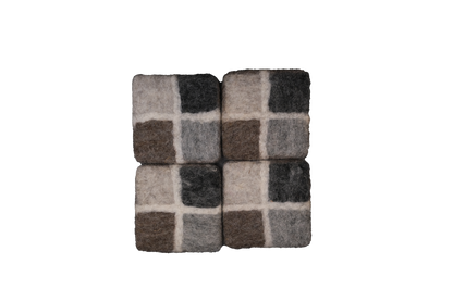 This Global Groove Life, handmade, ethical, fair trade, eco-friendly, sustainable, New Zealand wool felt, sand & stone, charcoal grey, brown, & stone coaster set, was created by artisans in Kathmandu Nepal and will bring colorful warmth and functionality to your table top.