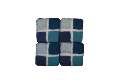 This Global Groove Life, handmade, ethical, fair trade, eco-friendly, sustainable, New Zealand wool felt, Ocean blue coaster set, was created by artisans in Kathmandu Nepal and will bring colorful warmth and functionality to your table top.