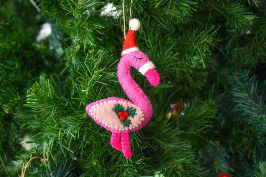 This Global Groove Life, handmade, ethical, fair trade, eco-friendly, sustainable, pink, white and red, felt Flamingo with Starfish ornament set was created by artisans in Kathmandu Nepal and will be a beautiful addition to your Christmas tree this holiday season.