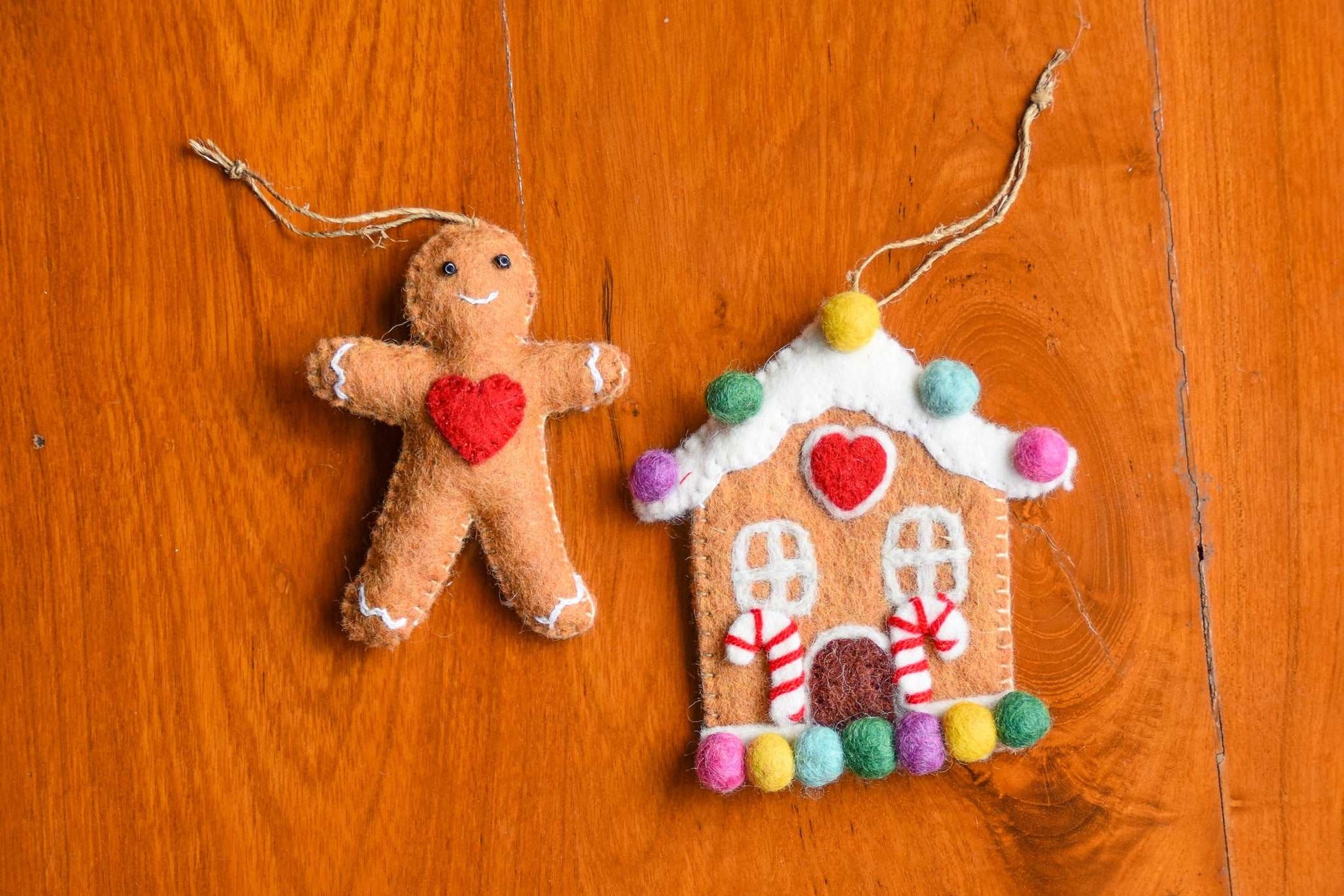 This Global Groove Life, handmade, ethical, fair trade, eco-friendly, sustainable, red heart gingerbread house and gingerbread friend with red heart felt ornament set was created by artisans in Kathmandu Nepal and will be a warm, colorful and fun addition to your Christmas tree this holiday season.