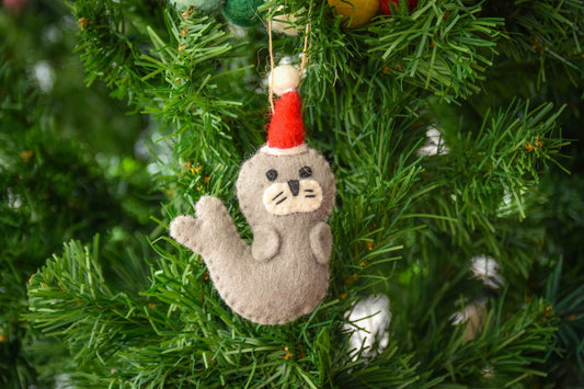 This Global Groove Life, handmade, ethical, fair trade, eco-friendly, sustainable, grey, white and red, felt Seal Santa with Starfish ornament set was created by artisans in Kathmandu Nepal and will be a beautiful addition to your Christmas tree this holiday season.
