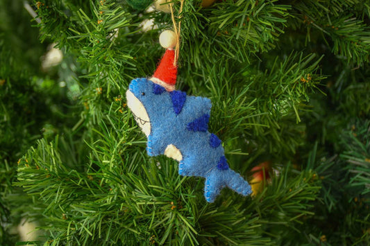 This Global Groove Life, handmade, ethical, fair trade, eco-friendly, sustainable, blue, white and red, felt Shark Santa with Starfish ornament set was created by artisans in Kathmandu Nepal and will be a beautiful addition to your Christmas tree this holiday season.