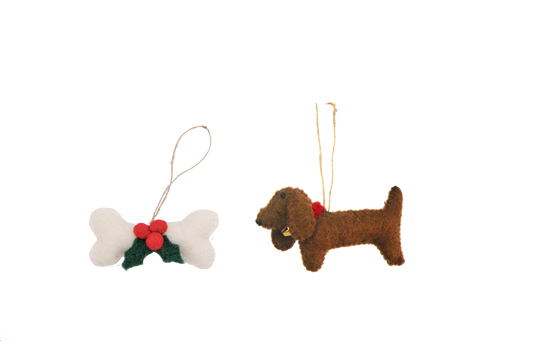 This Global Groove Life, handmade, ethical, fair trade, eco-friendly, sustainable, brown, Dachsund Dog with white, green and red bone treat ornament set was created by artisans in Kathmandu Nepal and will be a beautiful addition to your Christmas tree this holiday season.