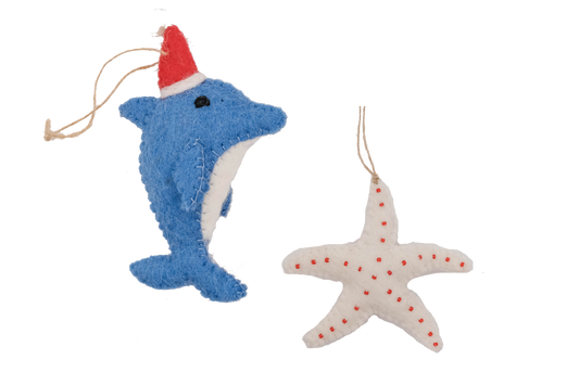 This Global Groove Life, handmade, ethical, fair trade, eco-friendly, sustainable, blue, white and red, felt Dolphin Santa with Starfish ornament set was created by artisans in Kathmandu Nepal and will be a beautiful addition to your Christmas tree this holiday season.