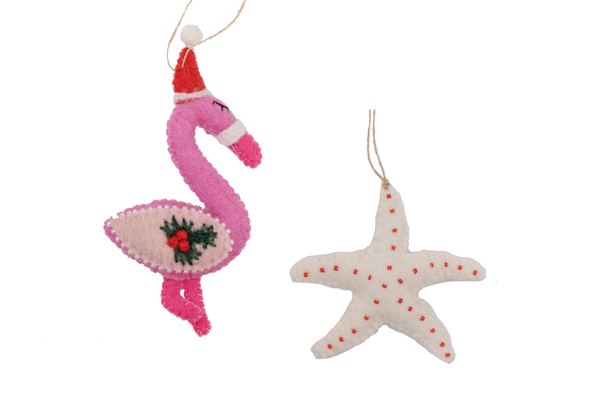 This Global Groove Life, handmade, ethical, fair trade, eco-friendly, sustainable, pink, white and red, felt Flamingo with Starfish ornament set was created by artisans in Kathmandu Nepal and will be a beautiful addition to your Christmas tree this holiday season.