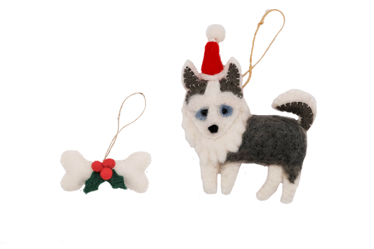 This Global Groove Life, handmade, ethical, fair trade, eco-friendly, sustainable, white and grey Husky Sant Dog with white, green and red bone treat ornament set was created by artisans in Kathmandu Nepal and will be a beautiful addition to your Christmas tree this holiday season.