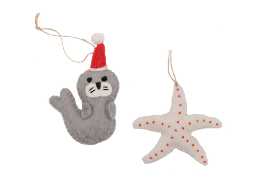 This Global Groove Life, handmade, ethical, fair trade, eco-friendly, sustainable, grey, white and red, felt Seal Santa with Starfish ornament set was created by artisans in Kathmandu Nepal and will be a beautiful addition to your Christmas tree this holiday season.