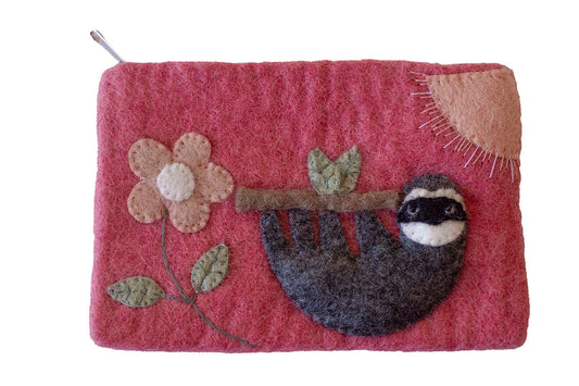 This Global Groove Life, handmade, ethical, fair trade, eco-friendly, sustainable, pink felt zipper coin pouch was created by artisans in Kathmandu Nepal and is adorned with an adorable sloth, flower and sun motif.