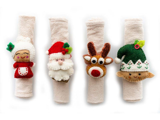 This Global Groove Life, handmade, ethical, fair trade, eco-friendly, sustainable, felt Christmas Napkin Ring set with Santa, Mrs. Claus, reindeer and elf, was created by artisans in Kathmandu Nepal and will bring colorful warmth and functionality to your table top.
