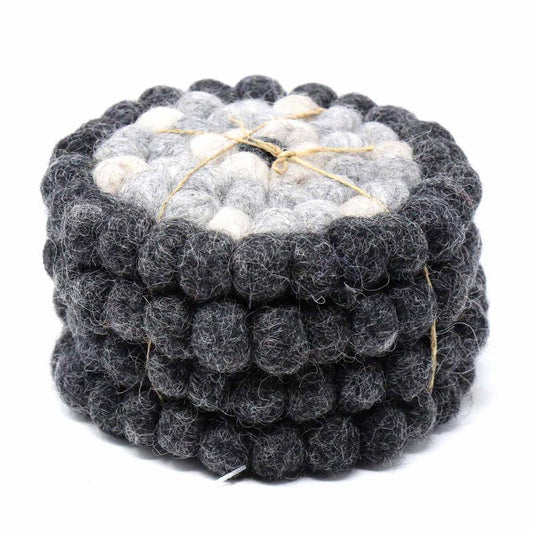 This Global Groove Life, handmade, ethical, fair trade, eco-friendly, sustainable, felt Flower Black/Grey coaster set was created by artisans in Kathmandu Nepal and will bring colorful warmth and functionality to your table top.