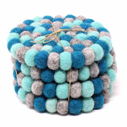 This Global Groove Life, handmade, ethical, fair trade, eco-friendly, sustainable, felt Chakra Light Blues coaster set was created by artisans in Kathmandu Nepal and will bring colorful warmth and functionality to your table top.