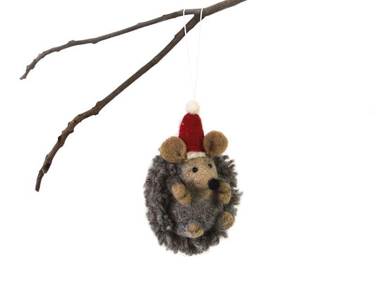 This Global Groove Life, handmade, ethical, fair trade, eco-friendly, sustainable, brown hedgehog with red Santa hat ornament, was created by artisans in Kathmandu Nepal and will be a beautiful addition to your Christmas tree this holiday season.