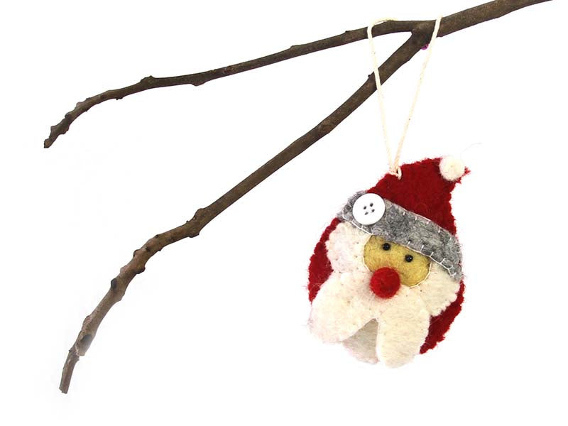 This Global Groove Life, handmade, ethical, fair trade, eco-friendly, sustainable, red, white and grey, Santa ornament was created by artisans in Kathmandu Nepal and will be a beautiful addition to your Christmas tree this holiday season.