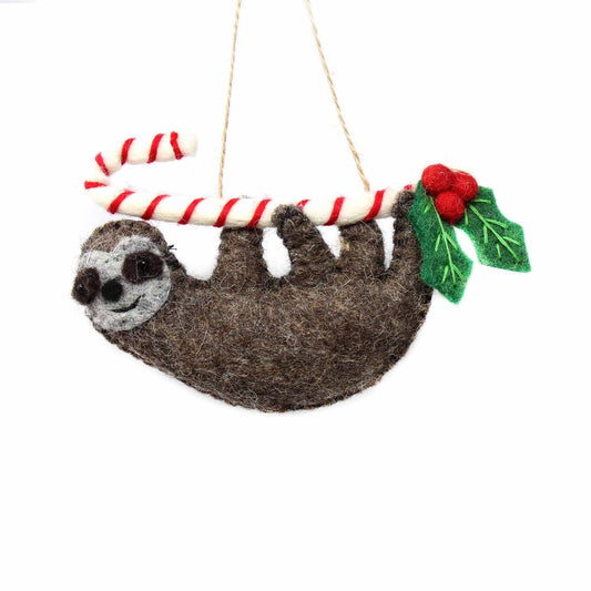 This Global Groove Life, handmade, ethical, fair trade, eco-friendly, sustainable, brown felt sloth ornament with candy cane was created by artisans in Kathmandu Nepal and will be a beautiful addition to your Christmas tree this holiday season.