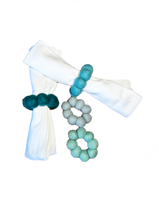 This Global Groove Life, handmade, ethical, fair trade, eco-friendly, sustainable, felt Teal Tonal Napkin Ring set was created by artisans in Kathmandu Nepal and will bring colorful warmth and functionality to your table top.