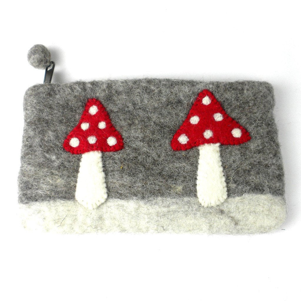 This Global Groove Life, handmade, ethical, fair trade, eco-friendly, sustainable, grey felt zipper coin pouch was created by artisans in Kathmandu Nepal and is adorned with an adorable red and white mushrooms motif.