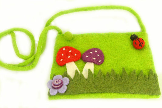 This Global Groove Life, handmade, ethical, fair trade, eco-friendly, sustainable, green felt purse was created by artisans in Kathmandu Nepal and is adorned with an adorable mushroom, flower and ladybug motif.